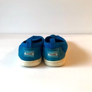 Bright Blue Tom’s slip on shoes.